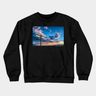 Metal Sign Against a Colorful Sky Crewneck Sweatshirt